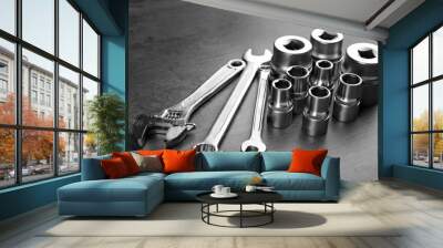 Setting of tools for car repair on grey table Wall mural