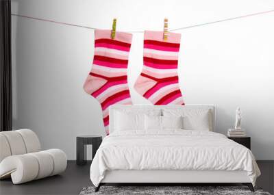 Socks hanging isolated on white Wall mural