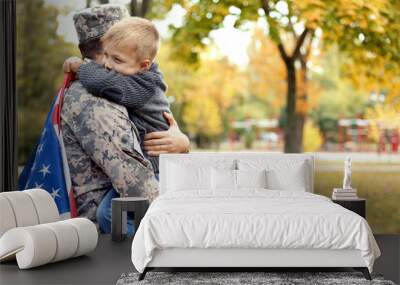 soldier reunited with his family on a sunny day Wall mural