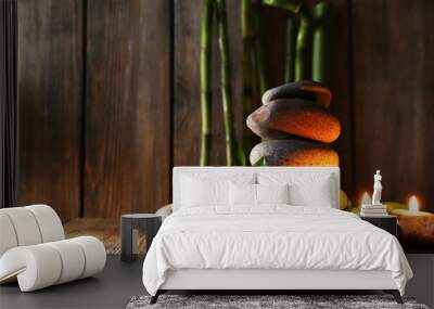 Spa stones, candles, bamboo branches Wall mural