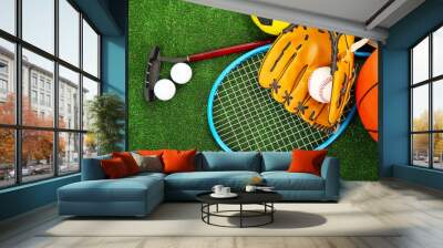 Sports equipment on grass background Wall mural