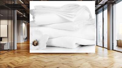 Stack of clean bedding sheets and towels isolated on white Wall mural