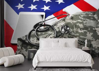 Stethoscope, military uniform and tablet on American national flag Wall mural