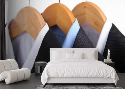 suits with shirts on hangers on light background Wall mural