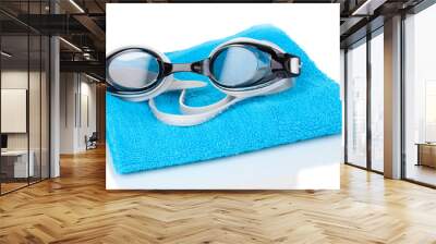 Swim goggles on towel isolated on white Wall mural