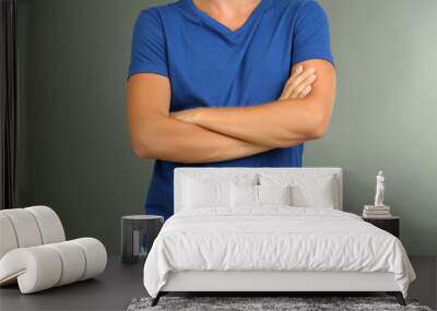 T-shirt on young man, on grey background Wall mural