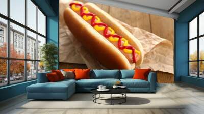 Tasty hot dog on wooden table Wall mural