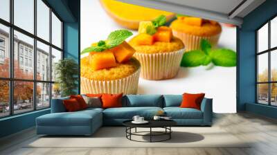 Tasty pumpkin muffins, isolated on white Wall mural