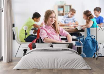 Teenage girl in wheelchair at school Wall mural