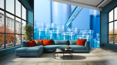 Test-tubes on blue background Wall mural