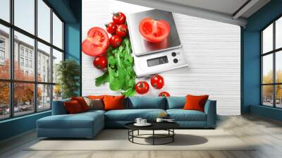 Tomatoes with digital kitchen scales on wooden background Wall mural