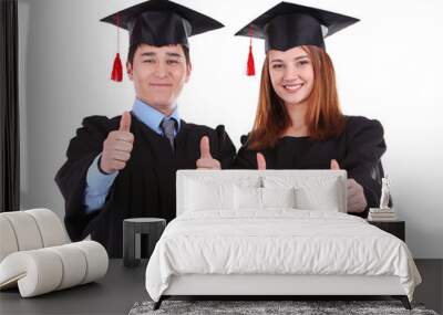 two happy graduating students isolated on white Wall mural