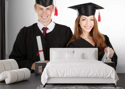 Two happy graduating students isolated on white Wall mural