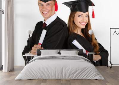 two happy graduating students isolated on white Wall mural