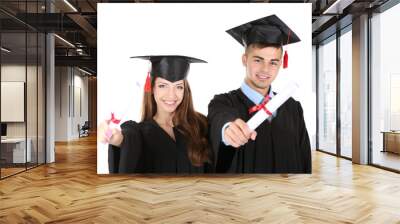 two happy graduating students isolated on white Wall mural