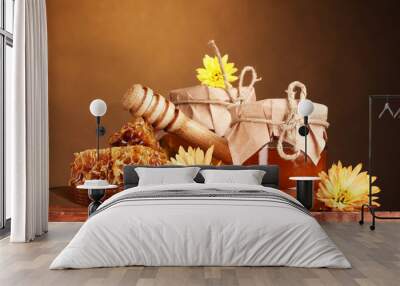 two jars of honey,honeycombs and wooden drizzler Wall mural