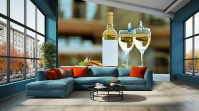 Wine bottle and two full glass on white table Wall mural