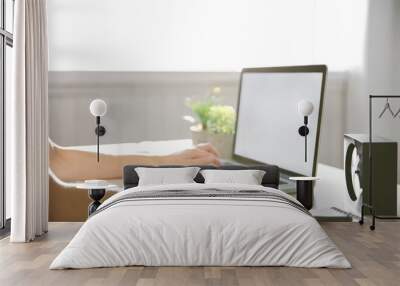 Woman working on computer at home Wall mural