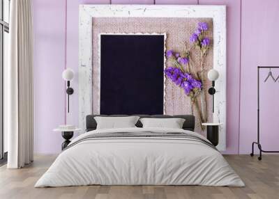 Wooden frame with dried flowers and old blank photo Wall mural