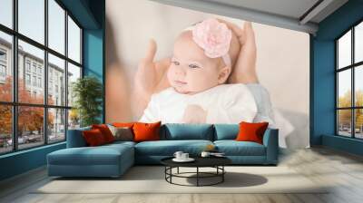 Young father with his cute little baby at home Wall mural