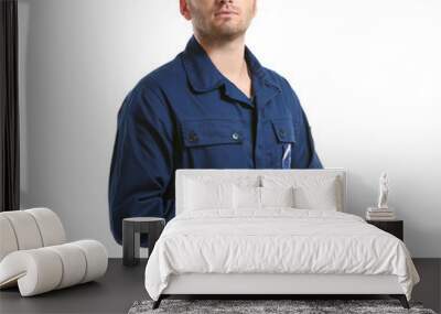 Young mechanic in uniform with rag standing, isolated on white Wall mural