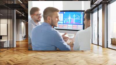 Young men working in office Wall mural