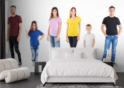 Young people wearing different t-shirts on white background Wall mural