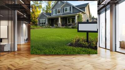 Blank yard sign in green grass on the white house background. Wall mural