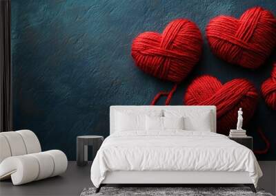 Red Yarn Hearts on Blue Background Wall mural