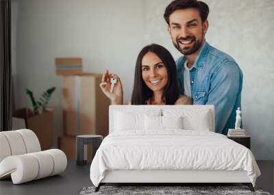 Excited young couple moving into a new home Wall mural