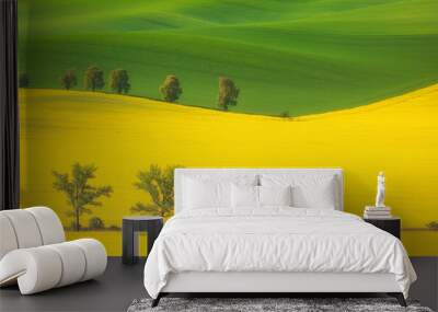 landscape with trees among yellow rapeseed flowers Wall mural