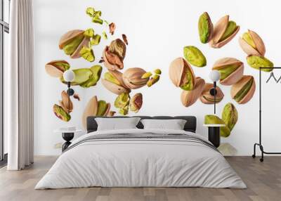 A set with Flying in air fresh raw whole and cracked pistachios  isolated on white background. Concept of Pistachios is torn to pieces close-up. High resolution image Wall mural