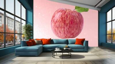 flying in air red fresh apple over pink background Wall mural