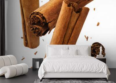 Fresh dried raw Cinnamon stick falling in the air Wall mural