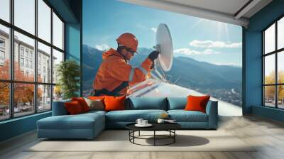 telecom engineer is adjusting satellite dish on rooftop, showcasing stunning mountain backdrop and bright sunlight. scene conveys sense of professionalism and dedication Wall mural