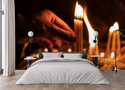 man hand candle in church Wall mural