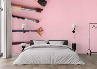 painting brushes on the pink table Wall mural