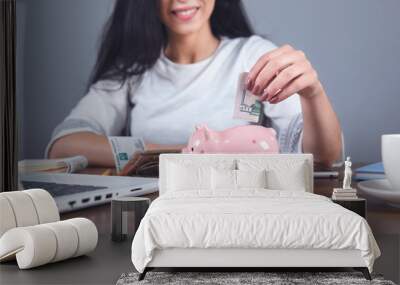 woman hand money with piggy bank Wall mural