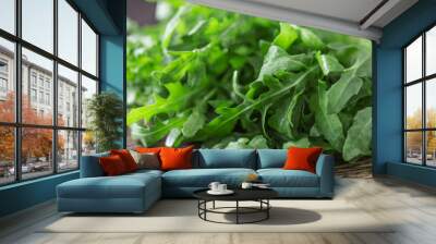 Fresh green arugula in bowl on table. Arugula rucola for salad. Close up of fresh green healthy food. Diet concept. Wall mural