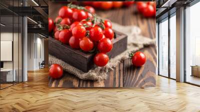 Small red cherry tomatoes on rustic background. Cherry tomatoes on the vine Wall mural