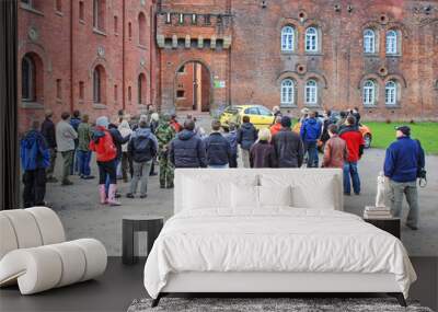 KRAKOW,POLAND - APRIL 10, 2010: Group of tourists visiting 19th century Austro-Hungarian fortifications Wall mural