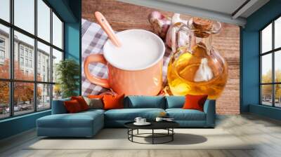 Natural remedy for flu: hot milk with honey and garlic. Wall mural