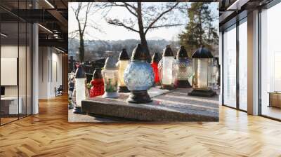 RABKA ZDROJ, POLAND - DECEMBER 06, 2019:  Various grave candles at the cemetery. Wall mural