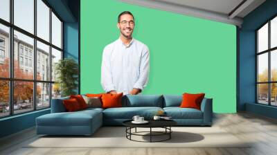 Happy young man looking up gesture Wall mural