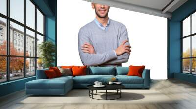 Satisfied young man with crossed arms gesture Wall mural