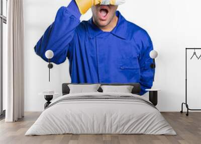 Workman covering his eyes with his hands on white background Wall mural