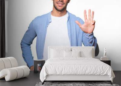 Young man making a number four gesture Wall mural