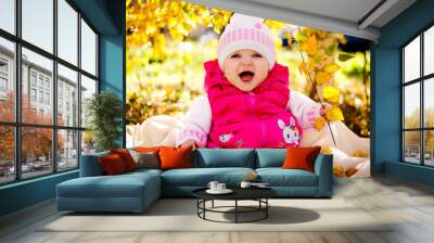 happy little child, baby girl laughing and playing in the autumn on the nature walk outdoors Wall mural