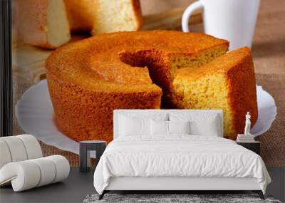 homemade corn cake on white plate on rustic wooden table. typical brazilian party food. Wall mural