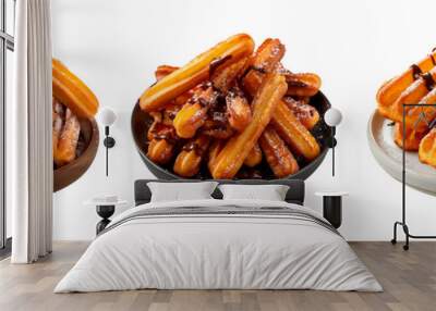 A set of churros with chocolate isolated on white or transparent background. Close-up Churros with chocolate in a wooden, white and black plate. Side view. Traditional Spanish dish. Wall mural